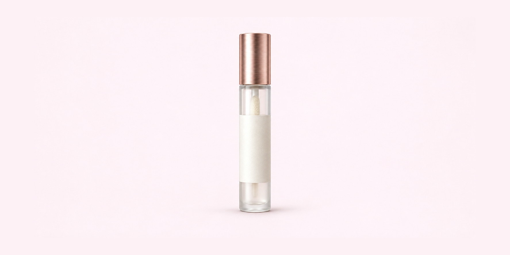 A slim glass serum vial with a rose gold cap, shot on pink